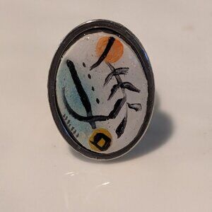 Handmade, carved, and painted clay and resin statement ring. Silver-tone. Modern